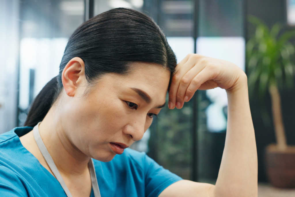 Woman experiencing stress and mental fatigue at work