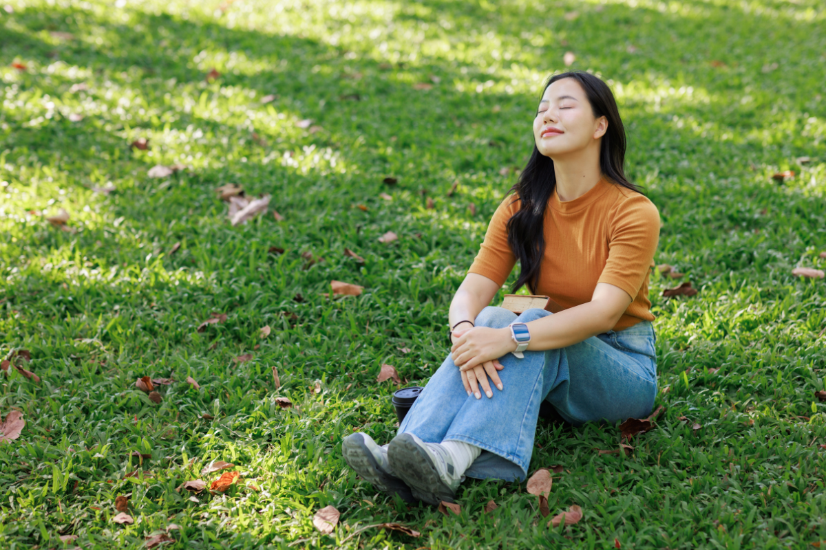 Woman relaxing outdoors for mental wellness