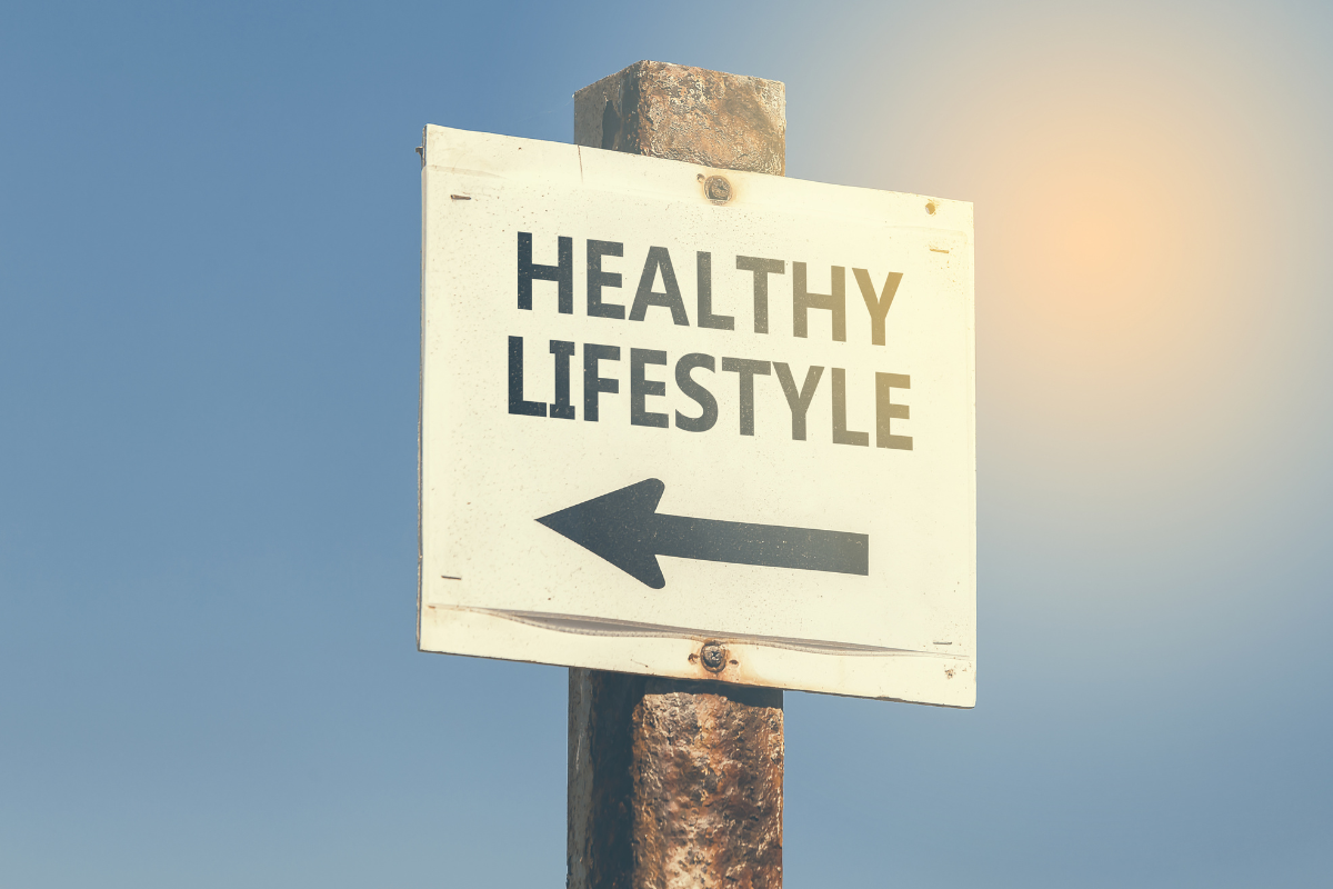 Healthy lifestyle sign pointing toward healthier living