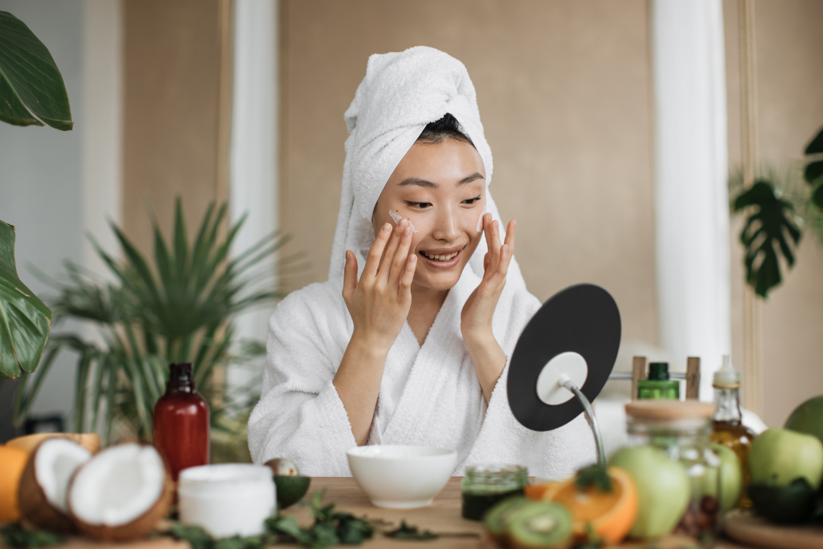 Woman caring for her skin as part of a healthy daily skincare routine