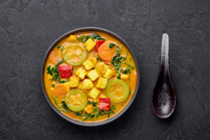 Vegetable Curry with Tofu served with colourful vegetables