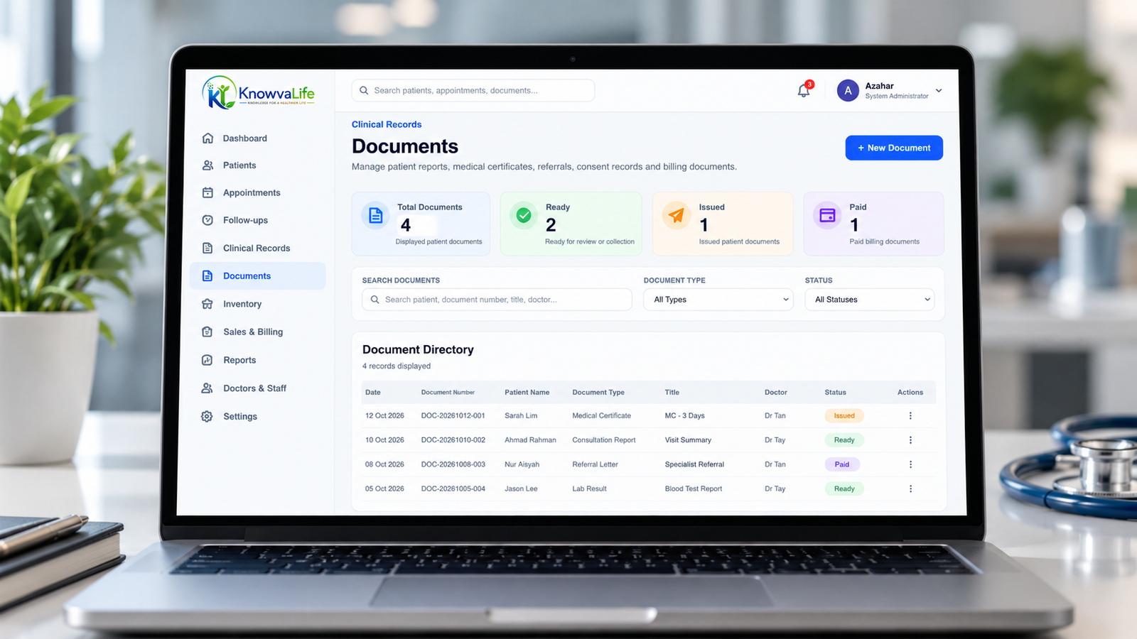 KnowvaLife software documents management demonstration shown on a laptop with sample data